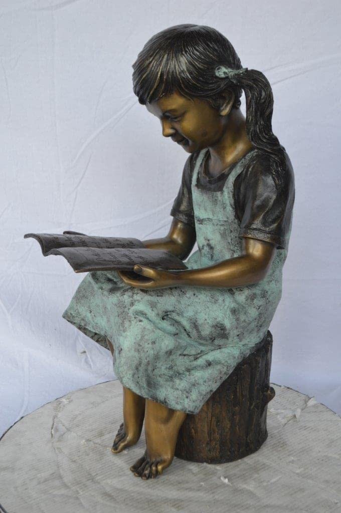 Young girl sitting and reading book bronze statue - Size: 16"L x 12"W x 27"H.