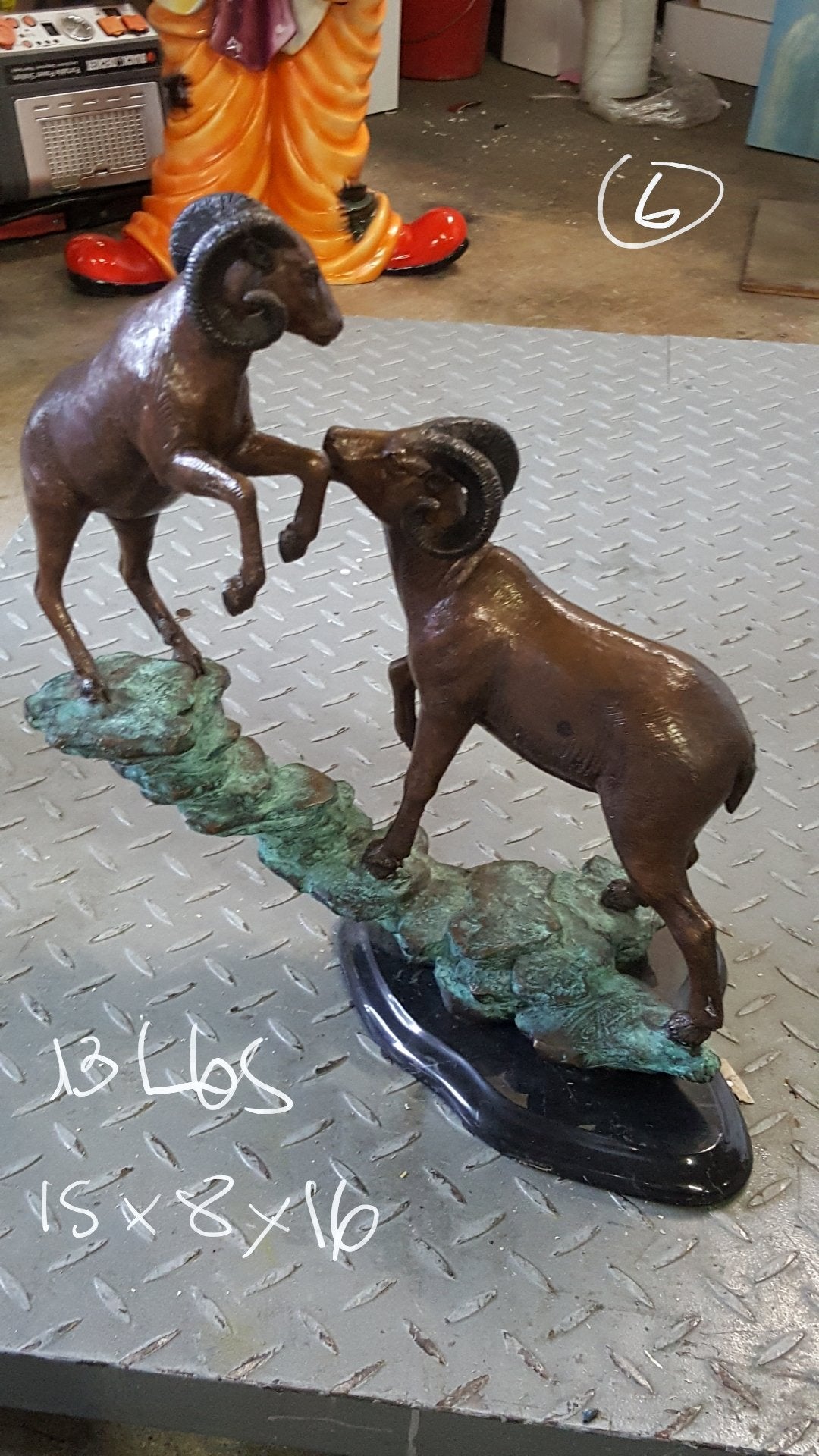 Two Rams on a rock Bronze Statue - Size: 15"L x 8"W x 16"H.