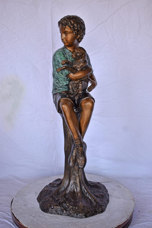 Boy Sitting on A Log with His Puppy Bronze Statue - Size: 15"L x 15"W x 35"H.