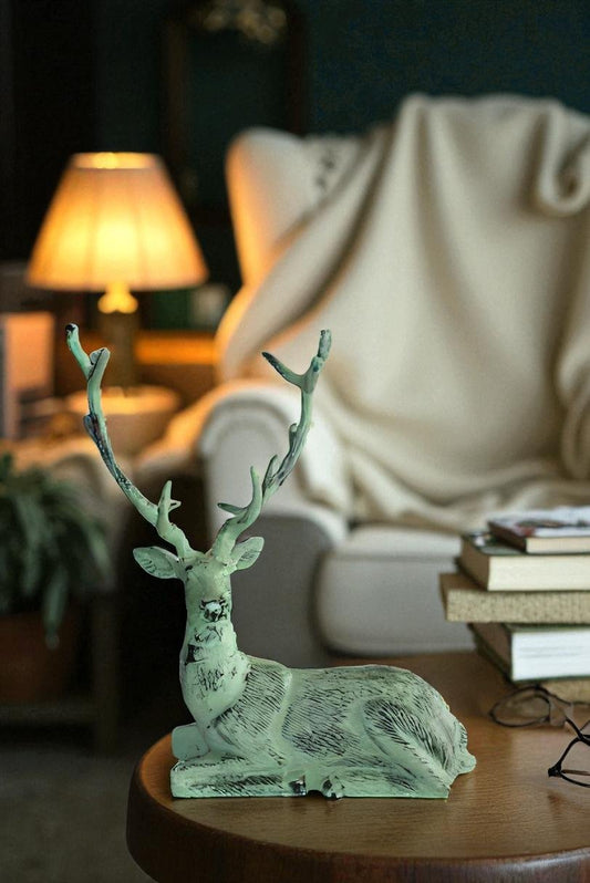 Aluminum Deer Statue Green Patina Resting on the ground 26" x 7" x 24"H