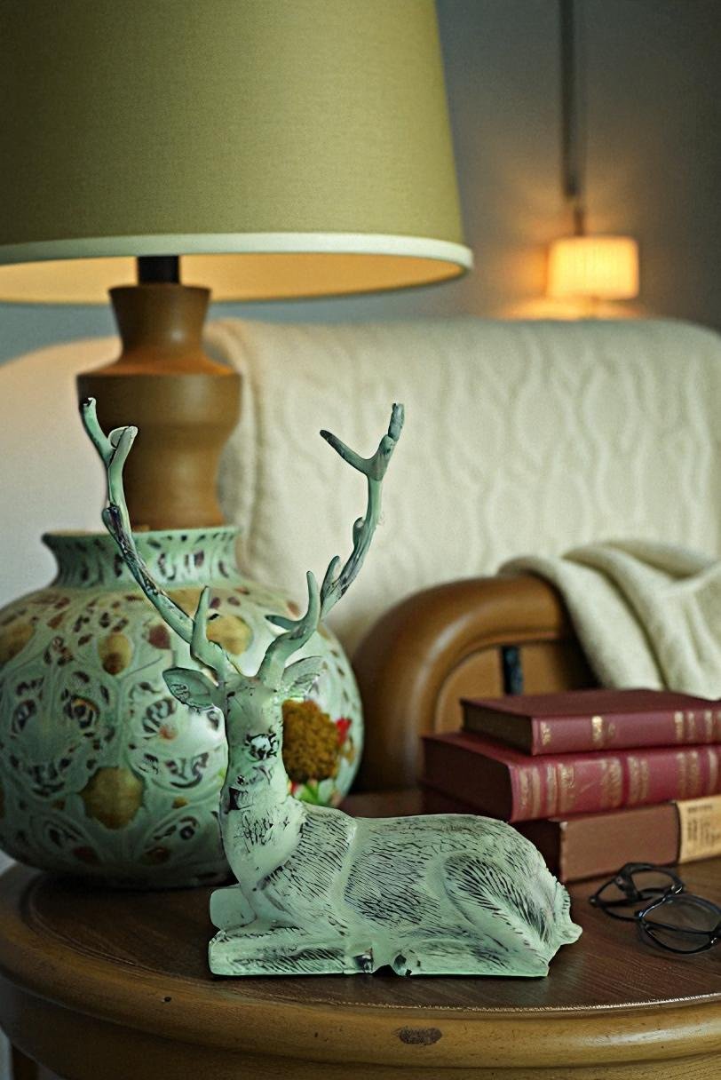 Aluminum Deer Statue Green Patina Resting on the ground 26" x 7" x 24"H