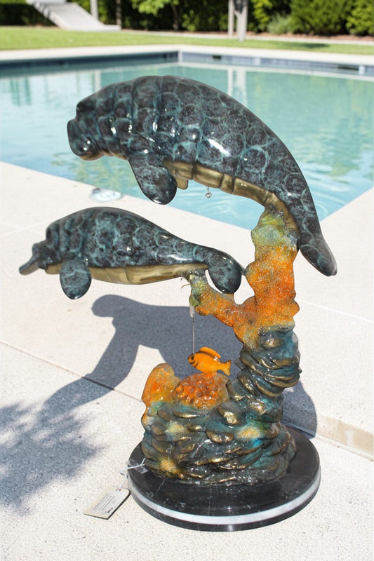 Manatees swimming - large Bronze Statue - Size: 18"L x 28"W x 38"H.