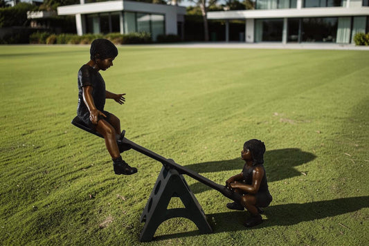 Playful Children on a See-Saw Bronze Statue Size: 76" x 27" x 59"H