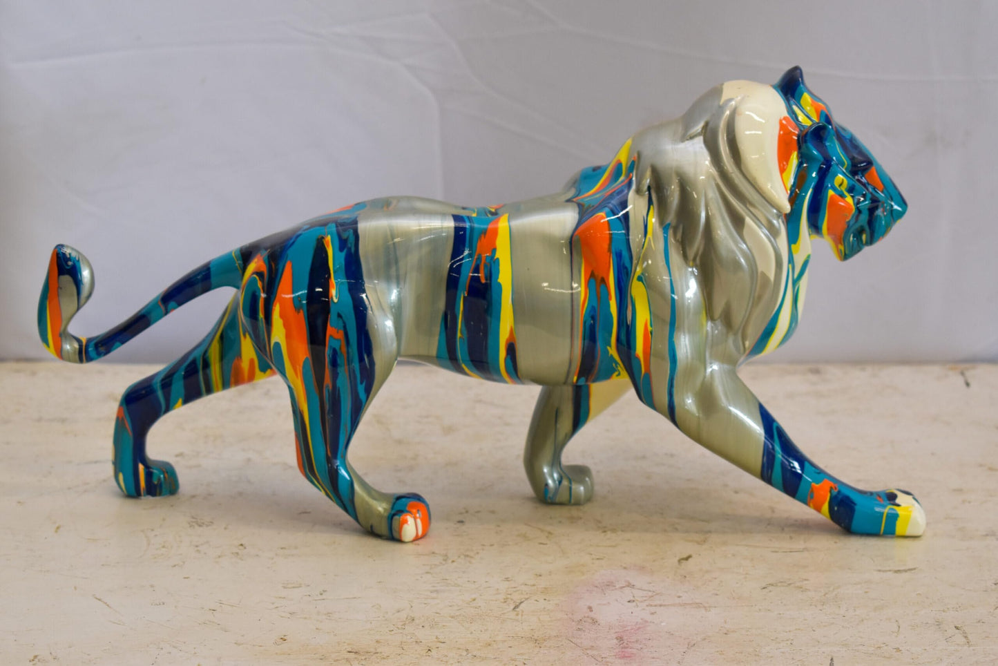Roaming Multicolored Lion Resin Statue 19" x 5" x 9"H