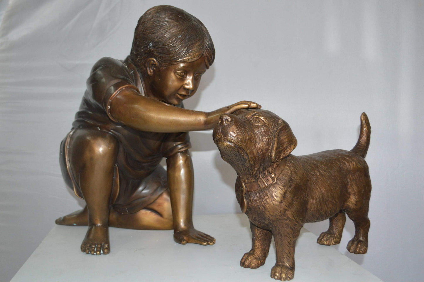 Boy and Dog Bronze Statue - Size: 30"L x 18"W x 18"H.