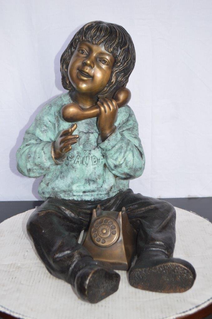 Young Child With an Old Telephone Bronze Statue - Size: 21"L x 14"W x 19"H.