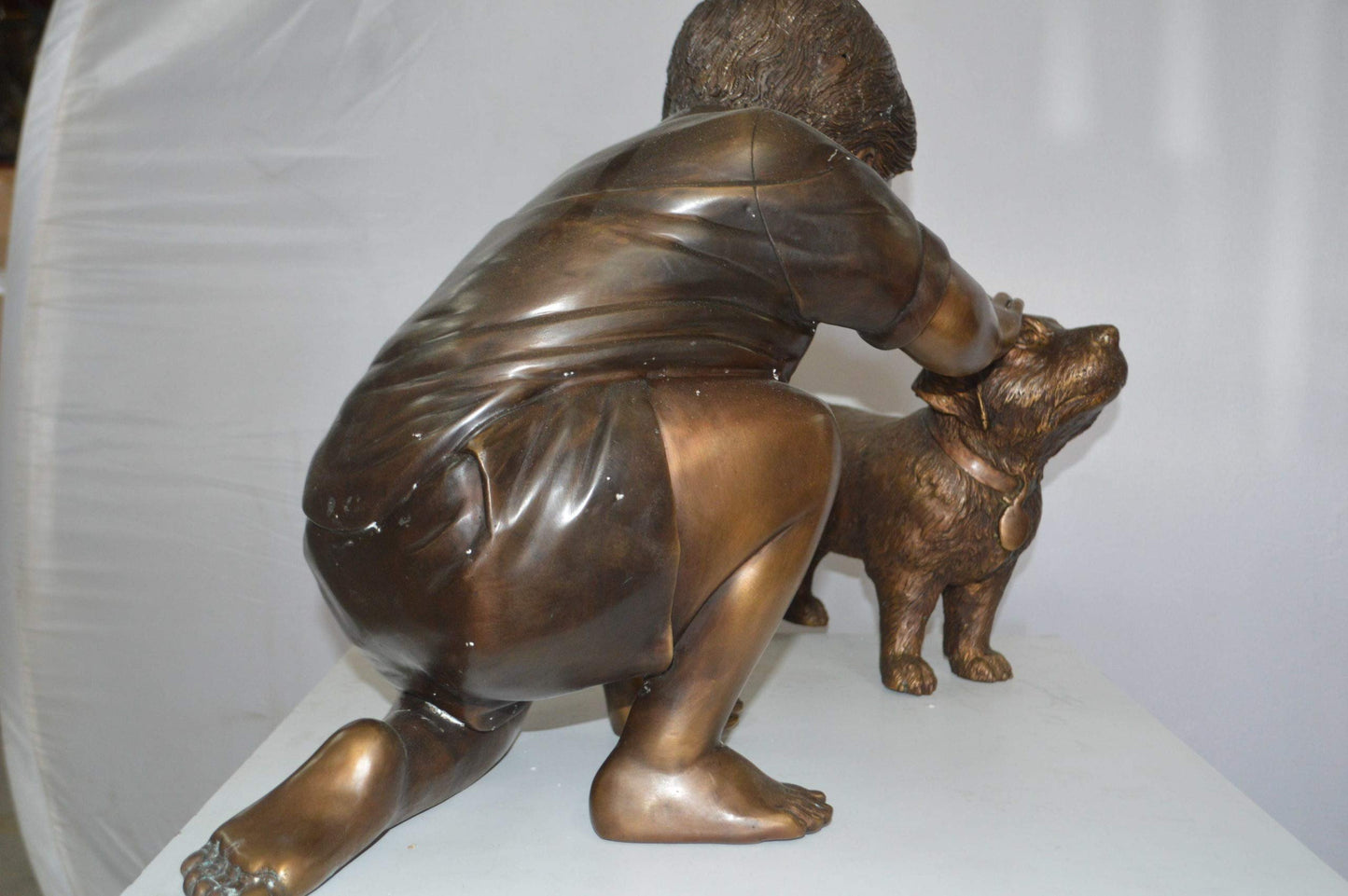 Boy and Dog Bronze Statue - Size: 30"L x 18"W x 18"H.