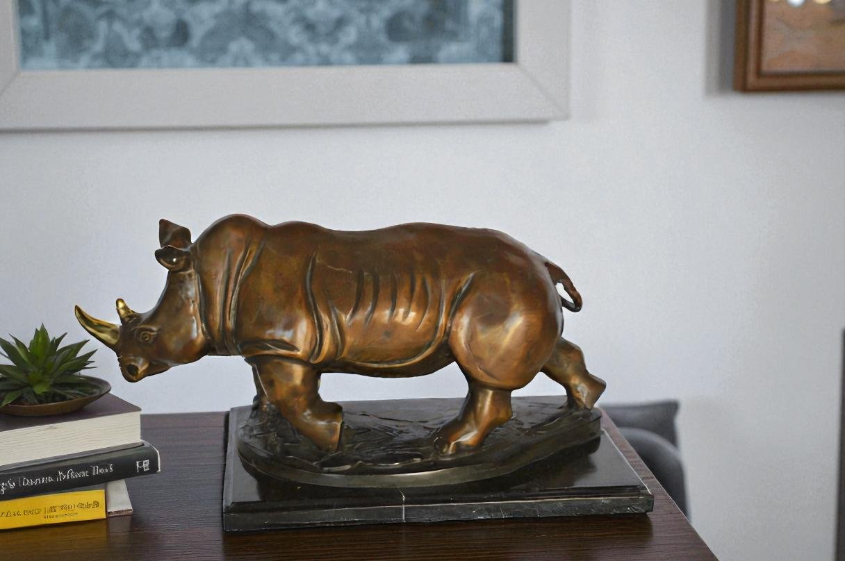 Rhino Bronze Statue Mounted on a Marble Base - Size: 21"L x 9"W x 10"H.
