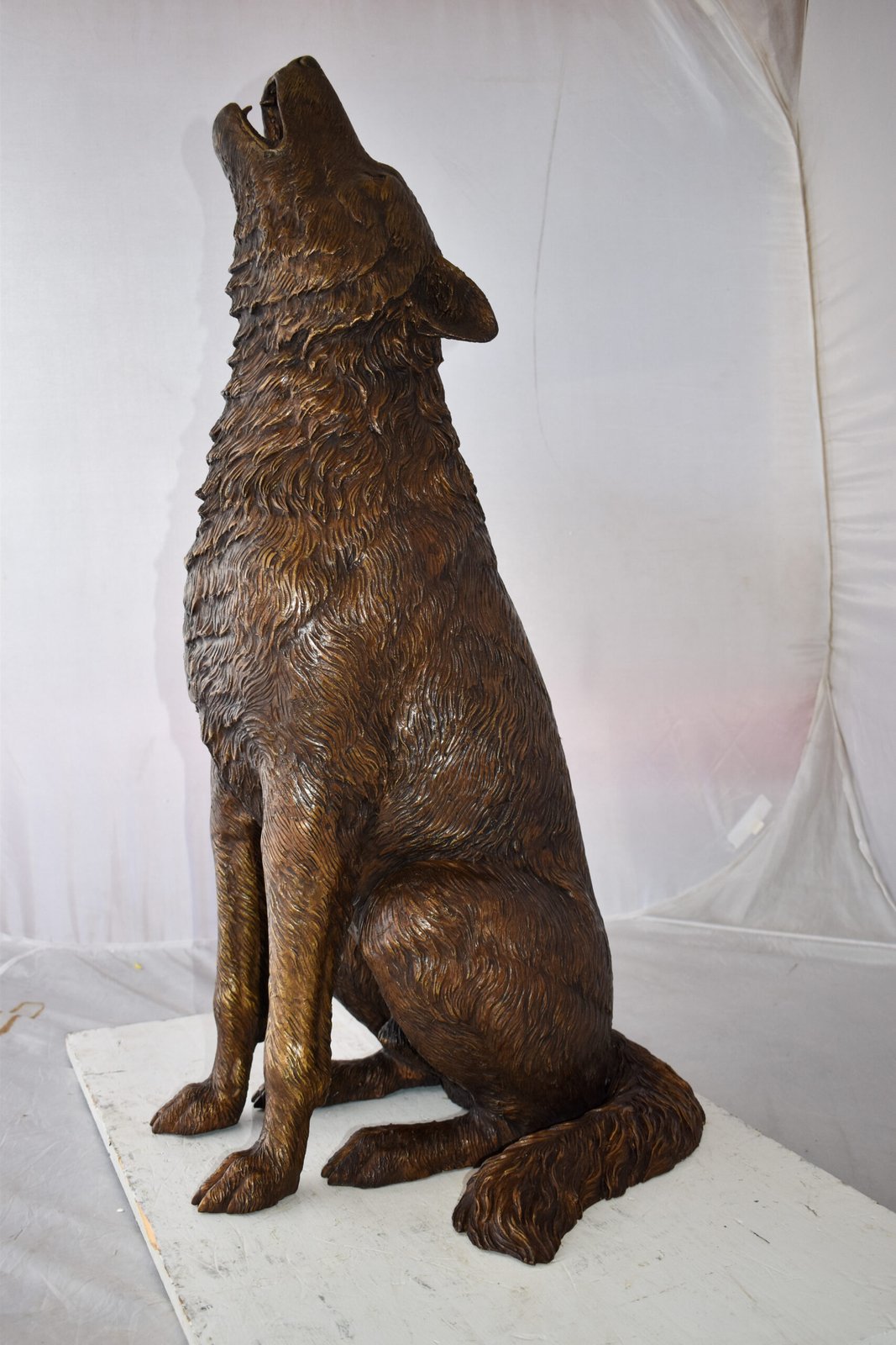 Howling Wolf looking toward the sky Bronze Statue Size: 19" x 19" x 37"H