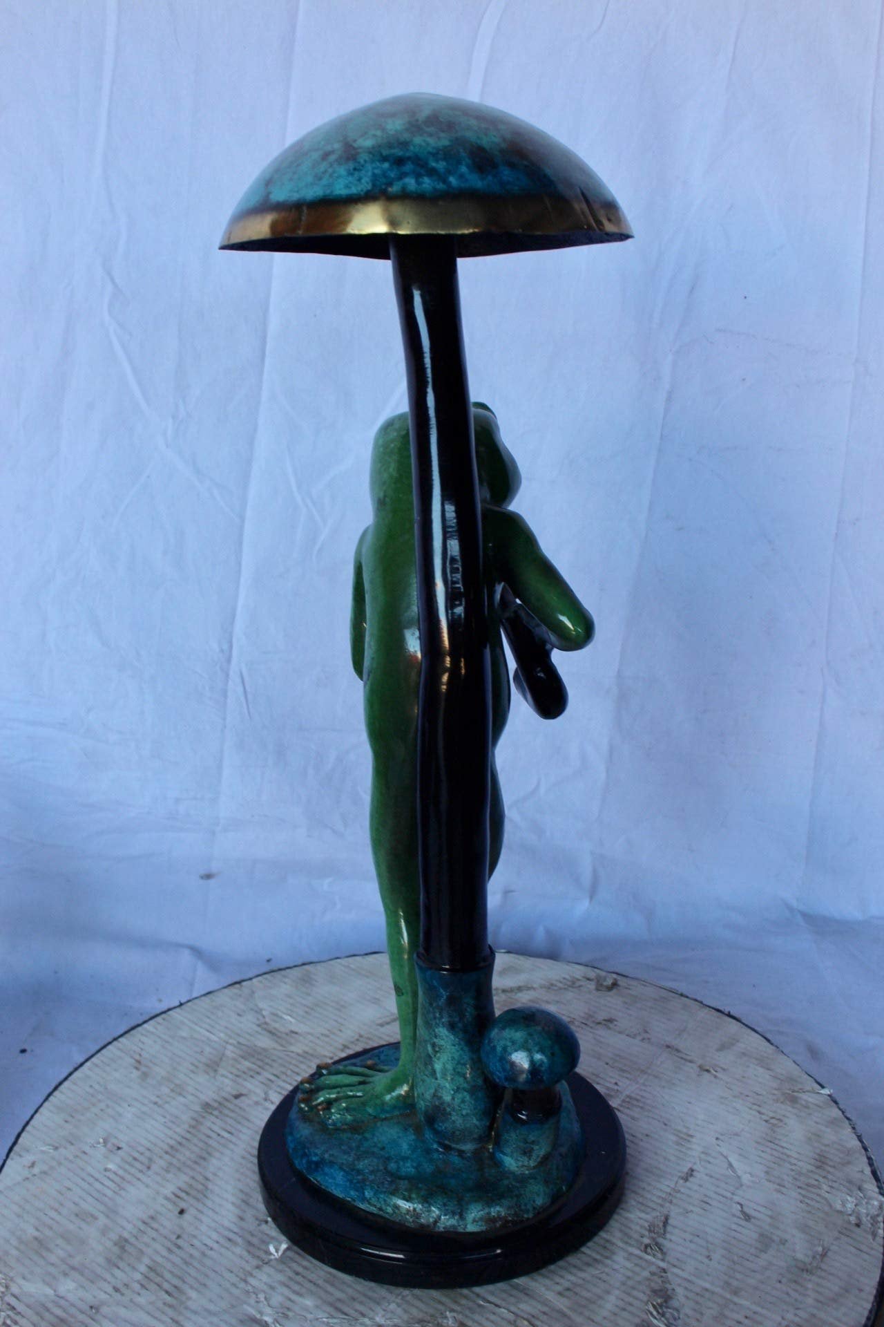 Jazzy frog perched under mushroom bronze statue - Size: 10"L x 10"W x 28"H.