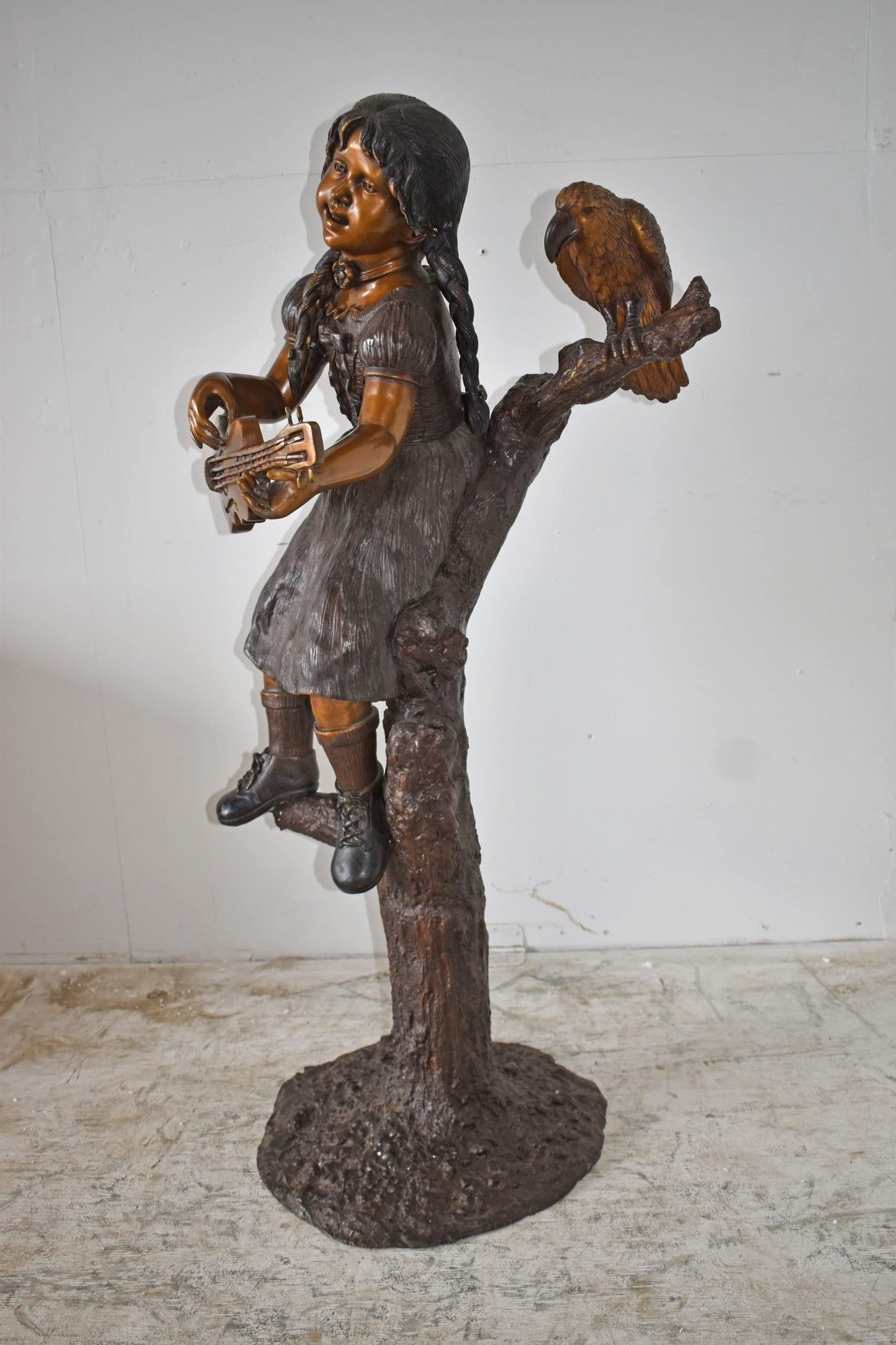 Girl on a Tree Playing the Ukulele with a Parrot Bronze Statue 25" x 23" x 50"H