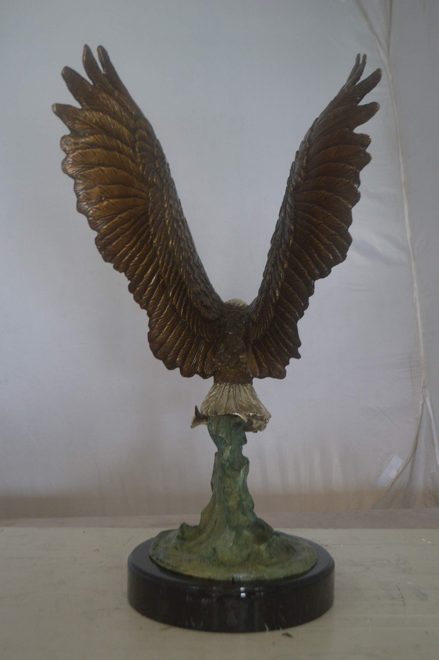 Eagle Catching His Prey from Water Bronze Statue - Size: 14"L x 13"W x 26"H.