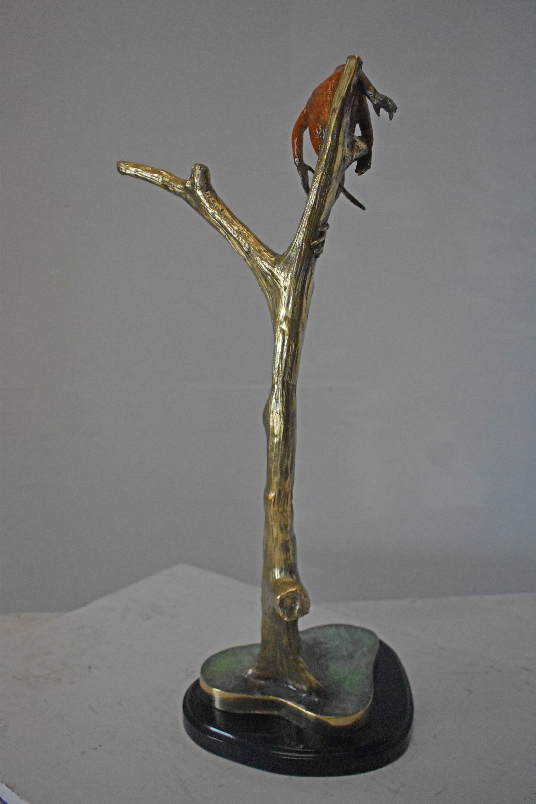 Colored Monkey Resting on a Tree Bronze Statue - Size: 12"L x 13"W x 27"H.