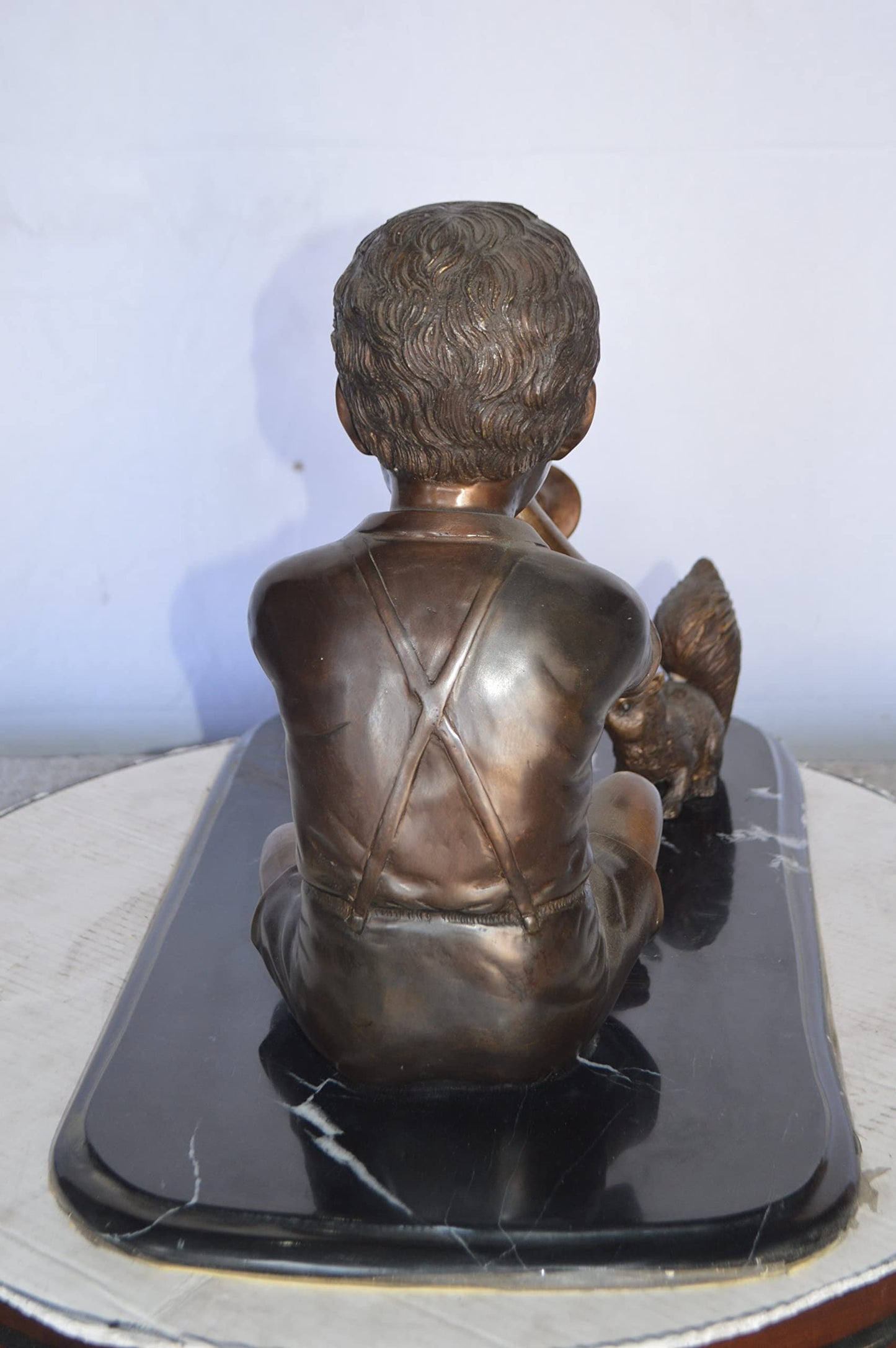 Boy With Rabbit And Squirrel Bronze Statue - Size: 22"L x 13"W x 16"H.