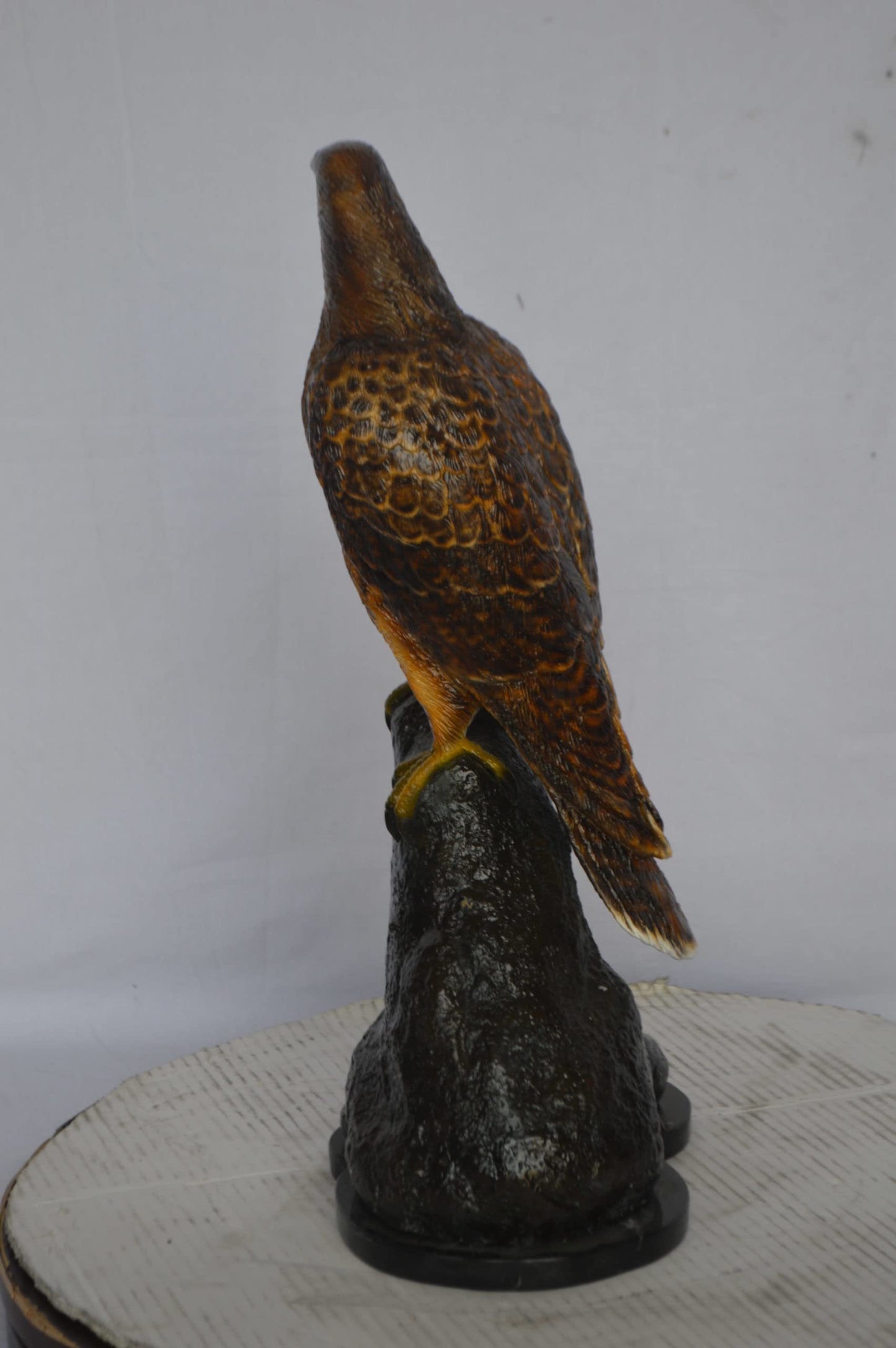 Hawk on a Rock bronze statue - Size: 12"L x 9"W x 22"H.