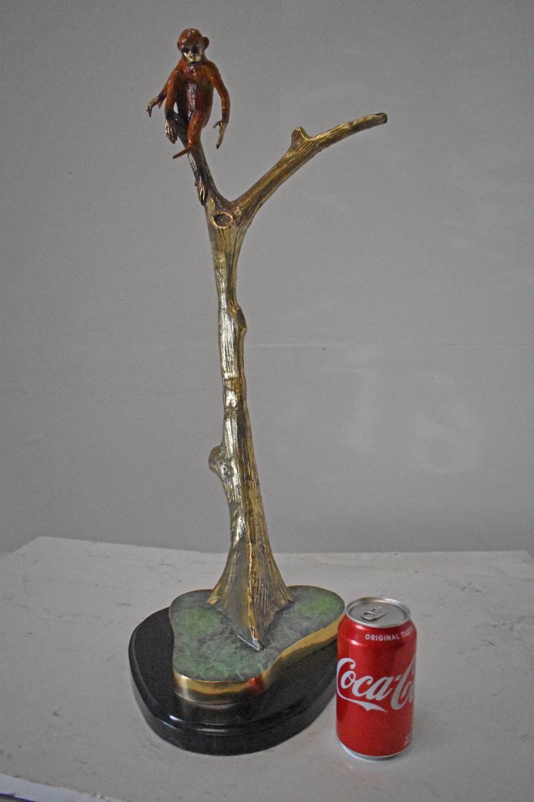 Colored Monkey Resting on a Tree Bronze Statue - Size: 12"L x 13"W x 27"H.