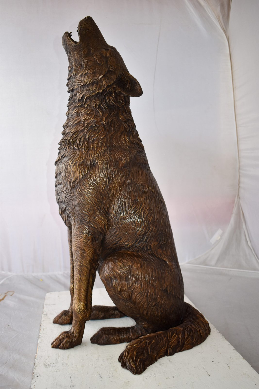 Howling Wolf looking toward the sky Bronze Statue Size: 19" x 19" x 37"H