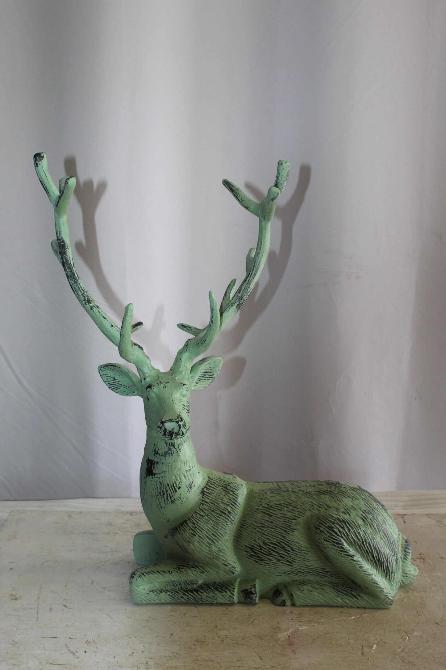Aluminum Deer Statue Green Patina Resting on the ground 26" x 7" x 24"H