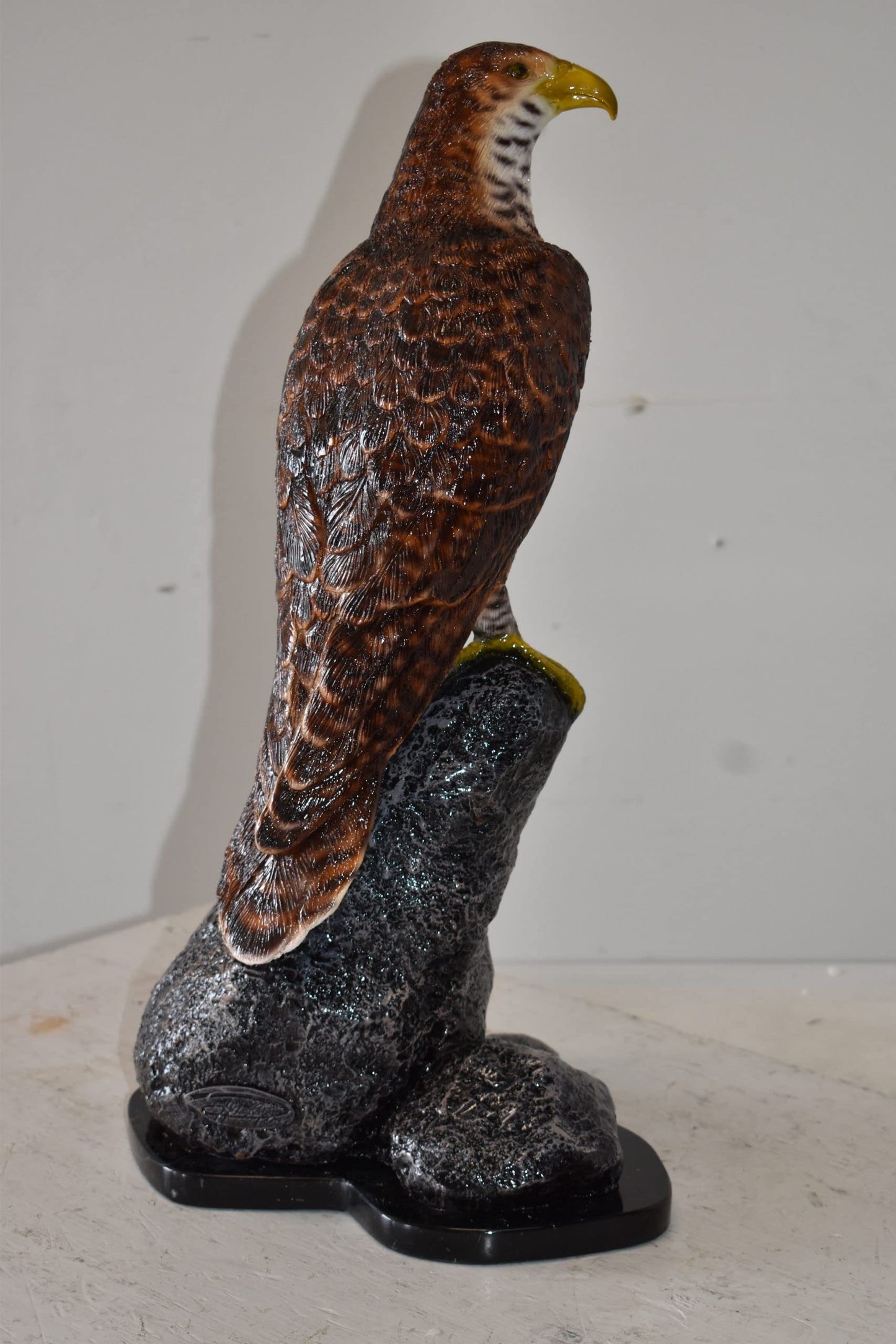 Eagle Standing on a Rock Looking for Prey Size: 10" x 13" x 22"H