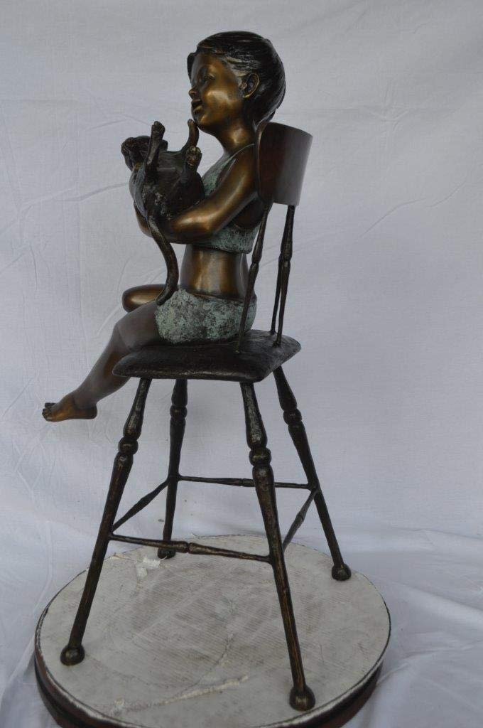 Girl with a cat on a high chair bronze statue - Size: 16"L x 16"W x 38"H.