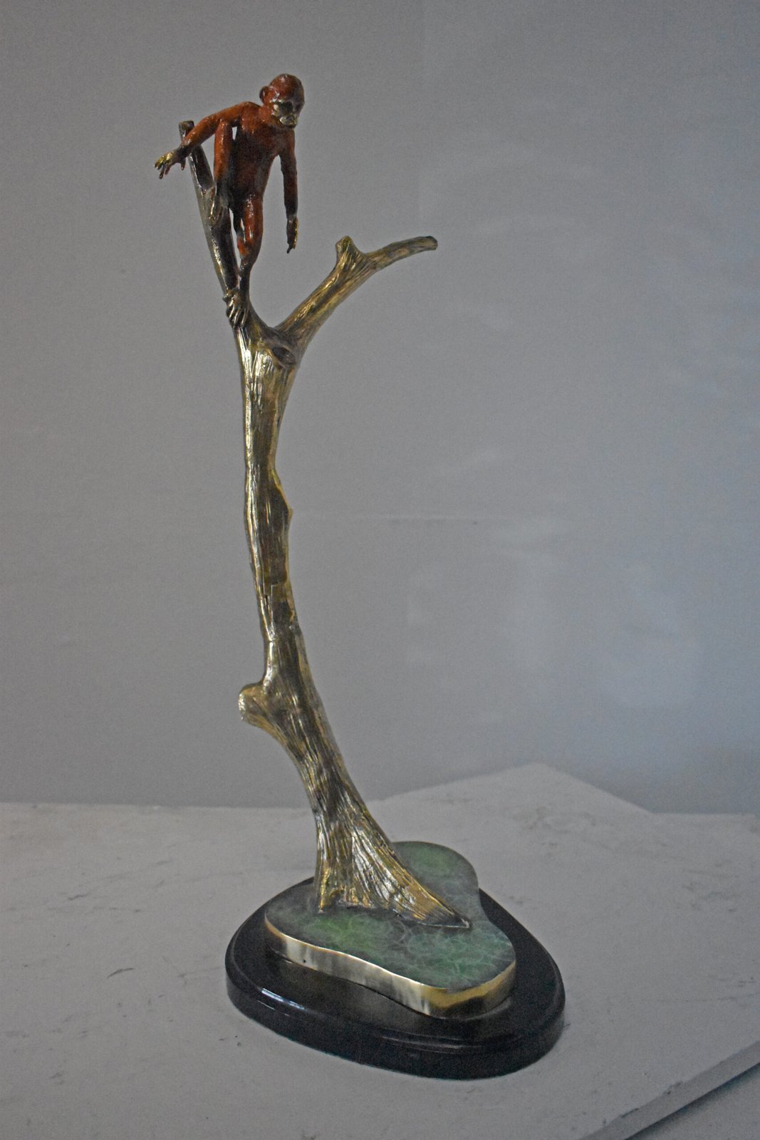 Colored Monkey Resting on a Tree Bronze Statue - Size: 12"L x 13"W x 27"H.