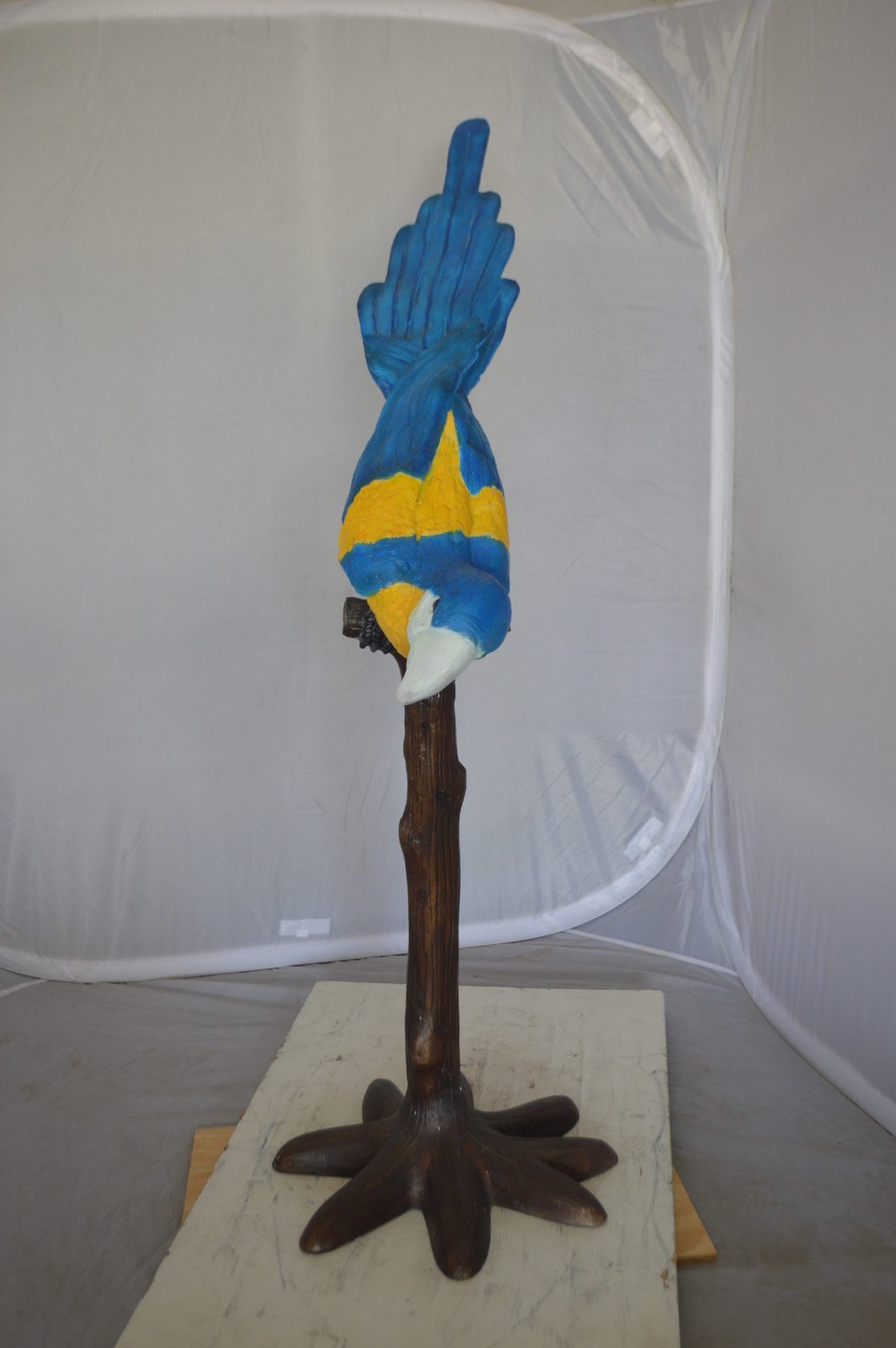 Parrot on Tree - Head Down Bronze Statue - Size: 39"L x 15"W x 47"H.