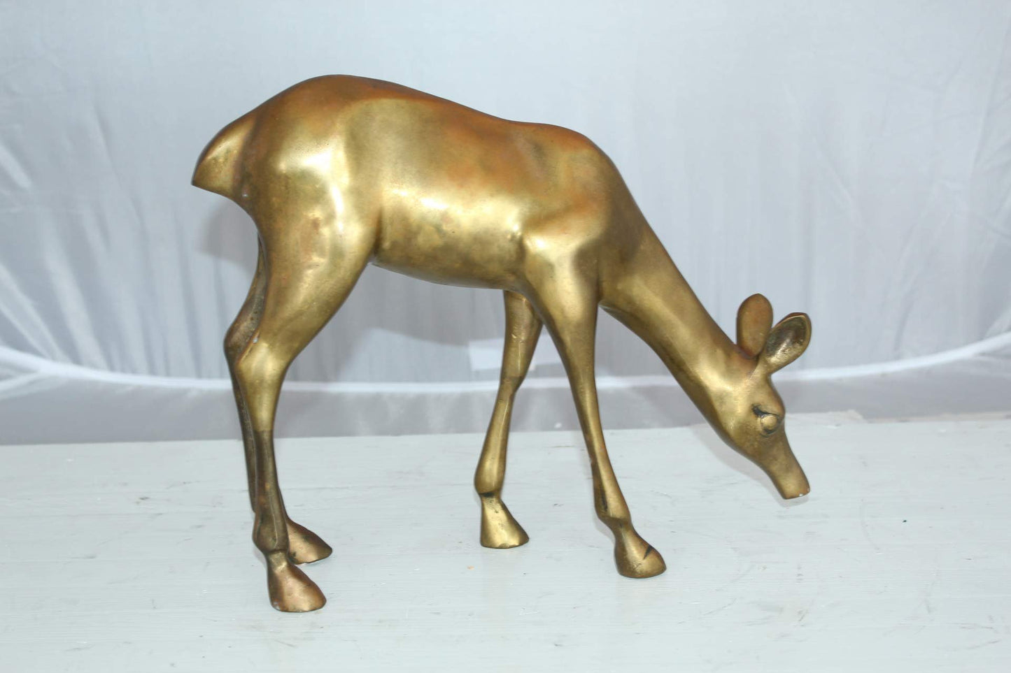Two Tone color deer bronze statue - Size: 13"L x 4"W x 11"H.