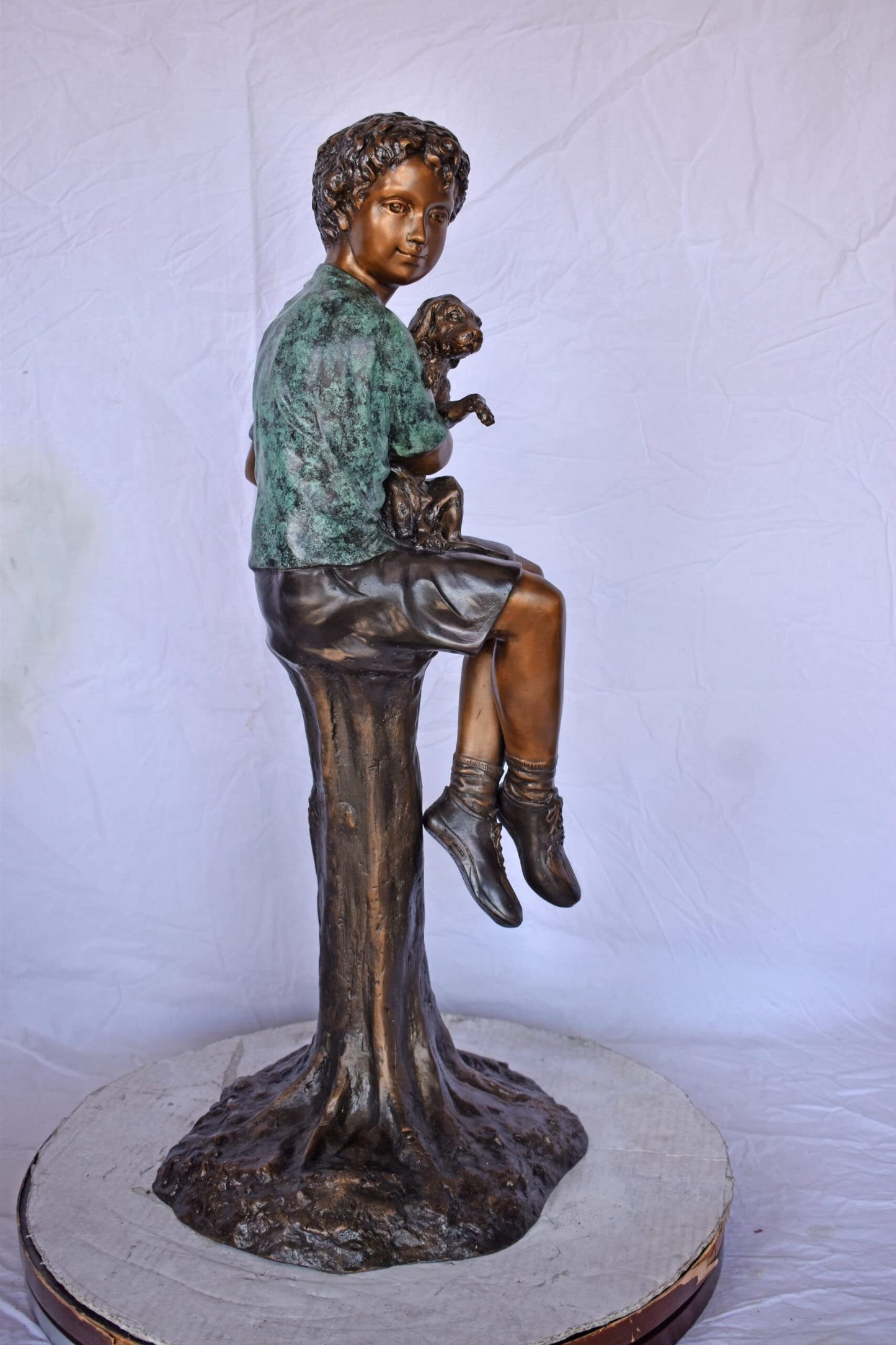 Boy Sitting on A Log with His Puppy Bronze Statue - Size: 15"L x 15"W x 35"H.