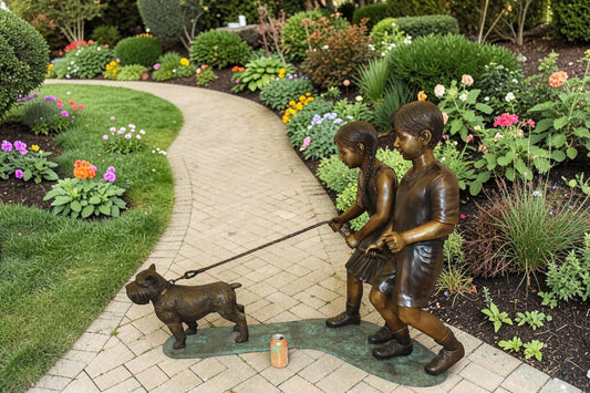 Two Kids Walking a dog Bronze Statue - Size: 55"L x 28"W x 37"H.