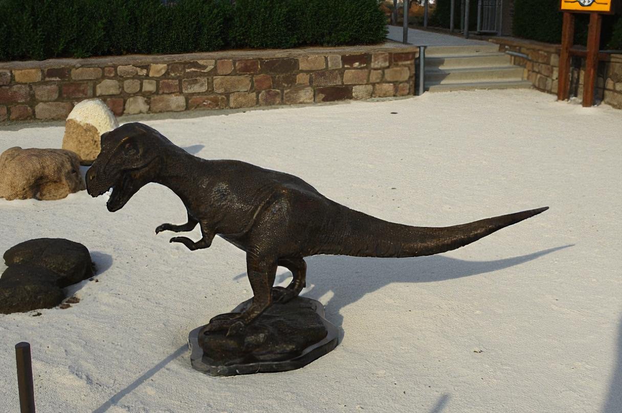 Tyrannosaurus Rex Dinosaur Bronze Statue -  Size: 31"L x 12"W x 15"H.