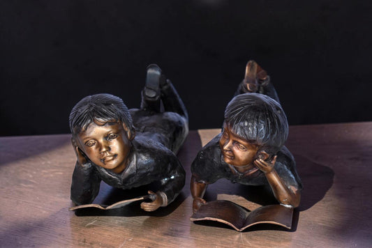 Young Kids Laying and Reading Cheerfully Bronze Statue Set Size: 20" x 13" x 8"H