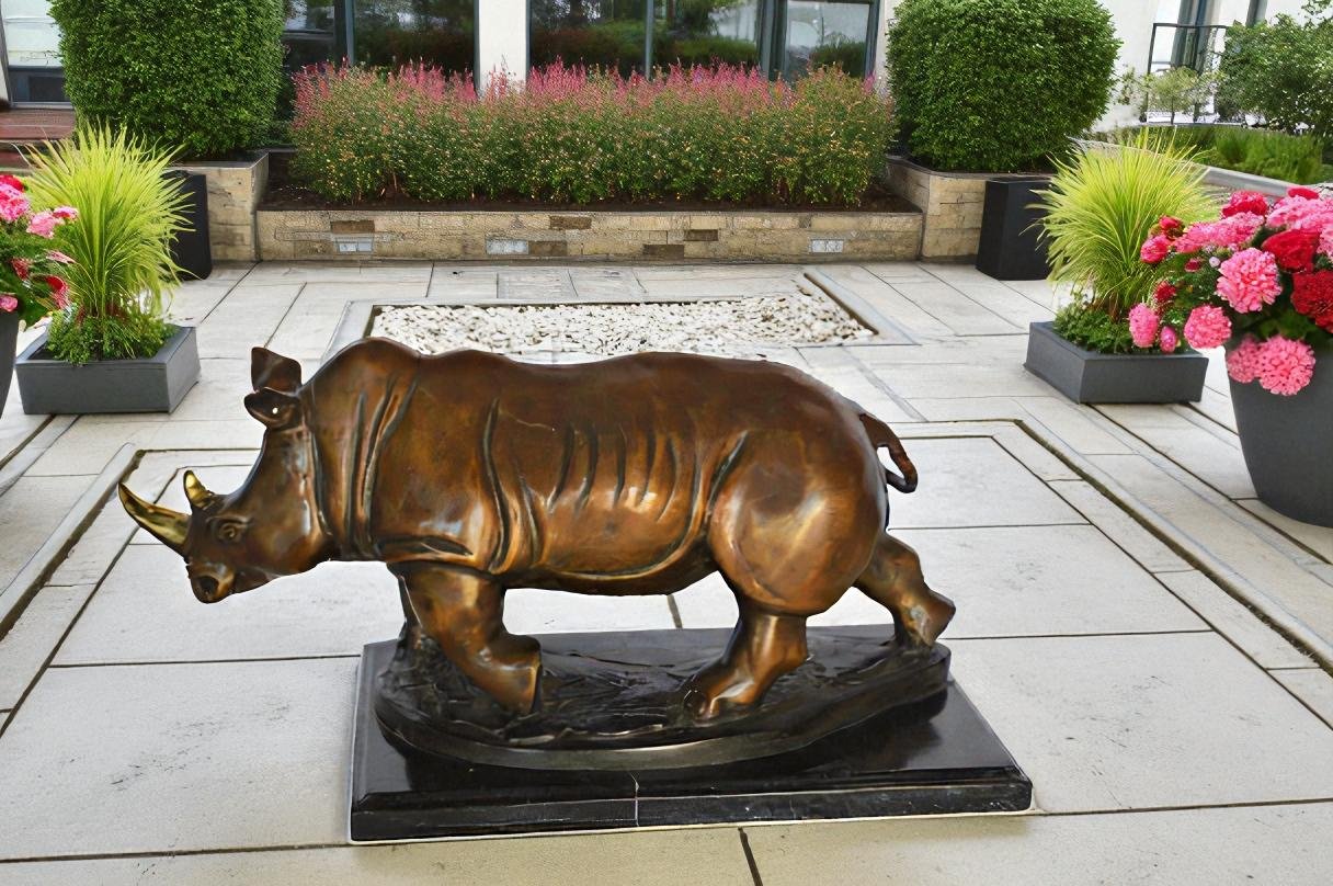 Rhino Bronze Statue Mounted on a Marble Base - Size: 21"L x 9"W x 10"H.