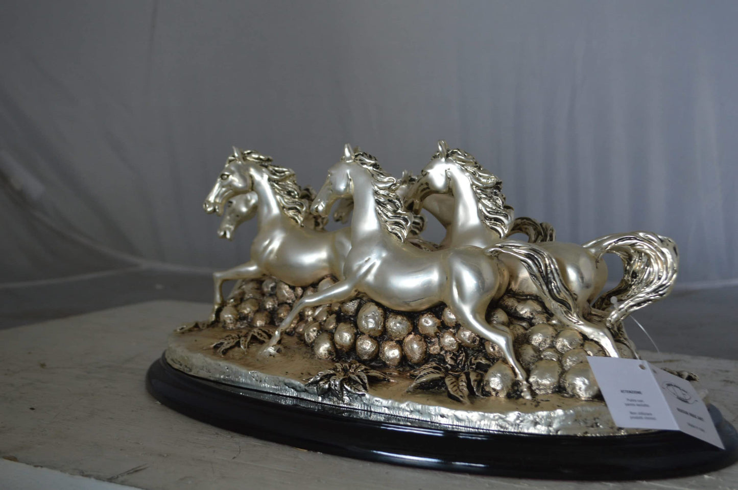 Charging horses resin statue on wood base - Size: 17"L x 10"W x 5"H.