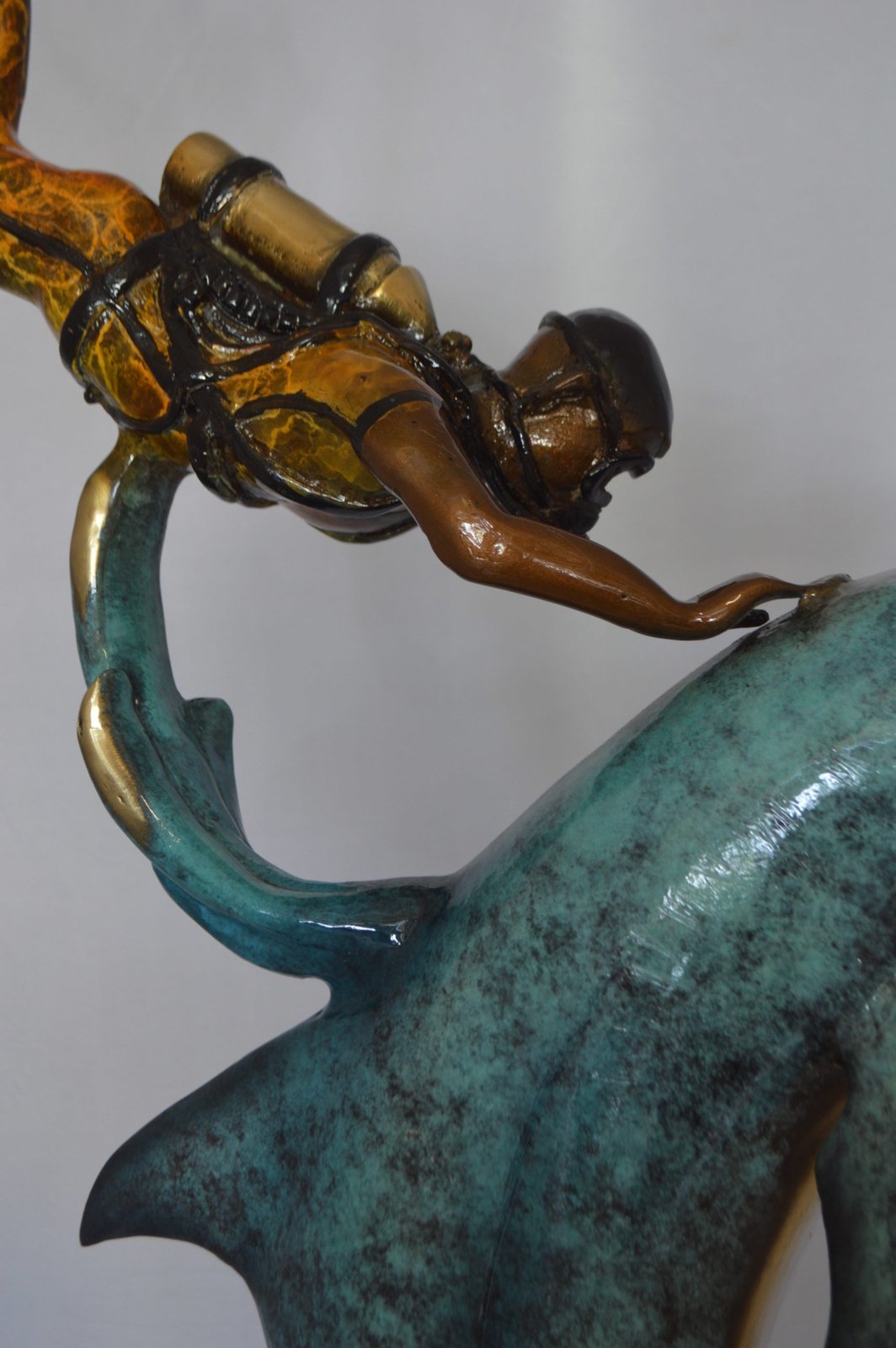 Diver With Dolphin Bronze Statue - Size: 10"L x 30"W x 49"H.