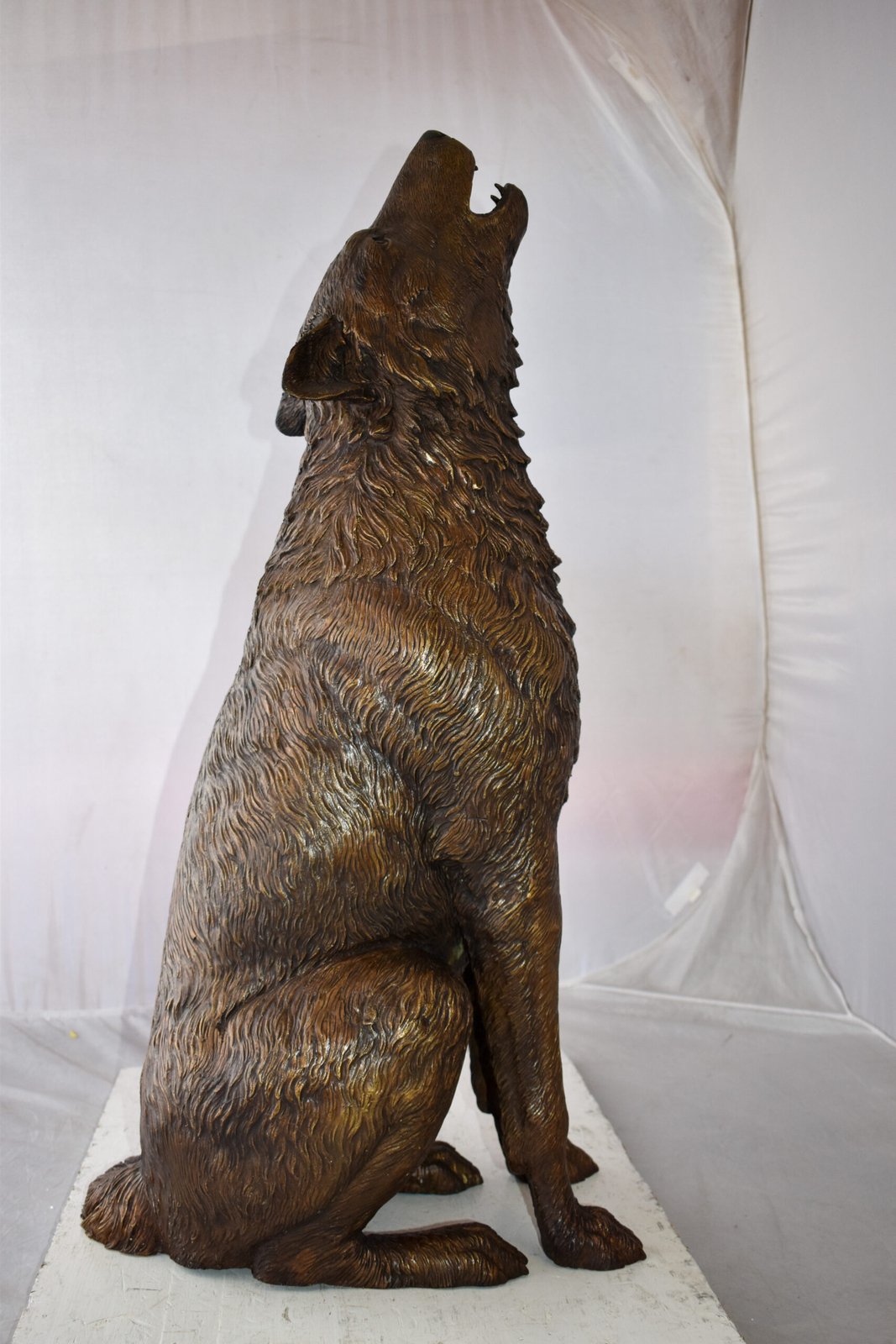 Howling Wolf looking toward the sky Bronze Statue Size: 19" x 19" x 37"H