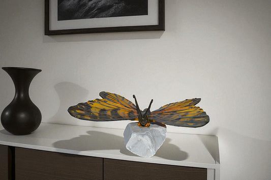 Orange Monarch butterfly bronze statue on a rock - Size: 14"L x 16"W x 8"H.