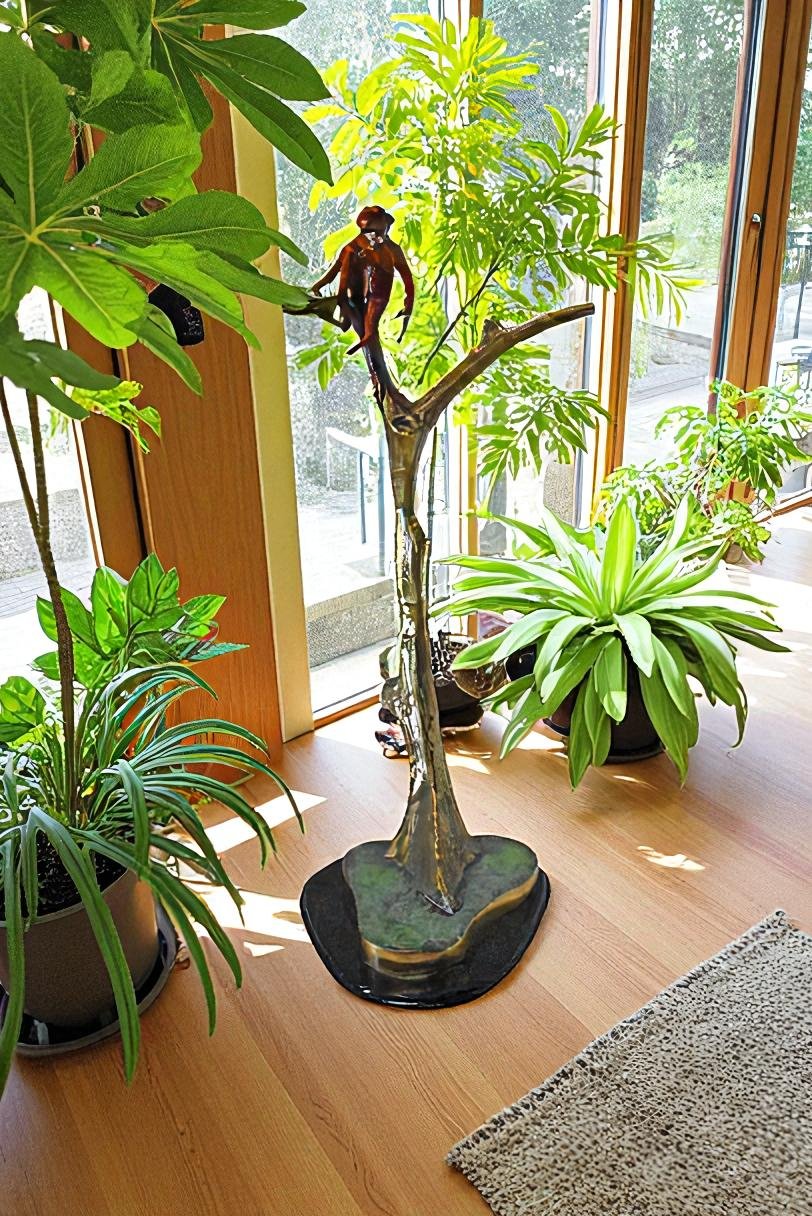 Colored Monkey Resting on a Tree Bronze Statue - Size: 12"L x 13"W x 27"H.