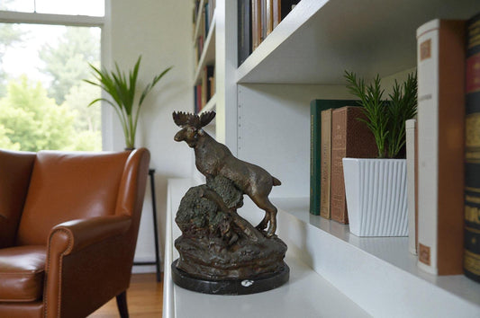 Moose on a rock bronze statue - Size: 9"L x 7"W x 14"H.