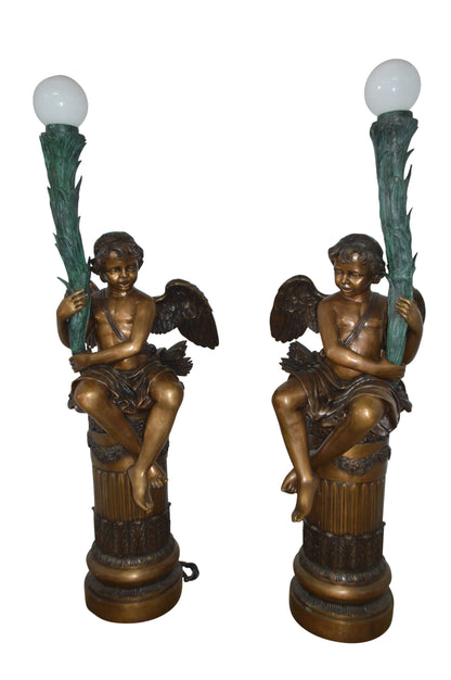 Pair of Cupid on stand lamp -  Size: 28"L x 24"W x 90"H.