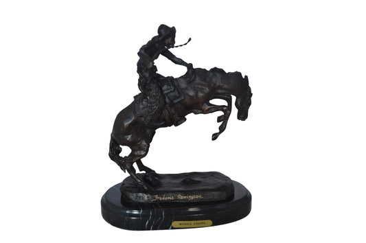 Wooly Chaps Bronze Statue by Remington 13H -  Size: 8"L x 3"W x 9"H.