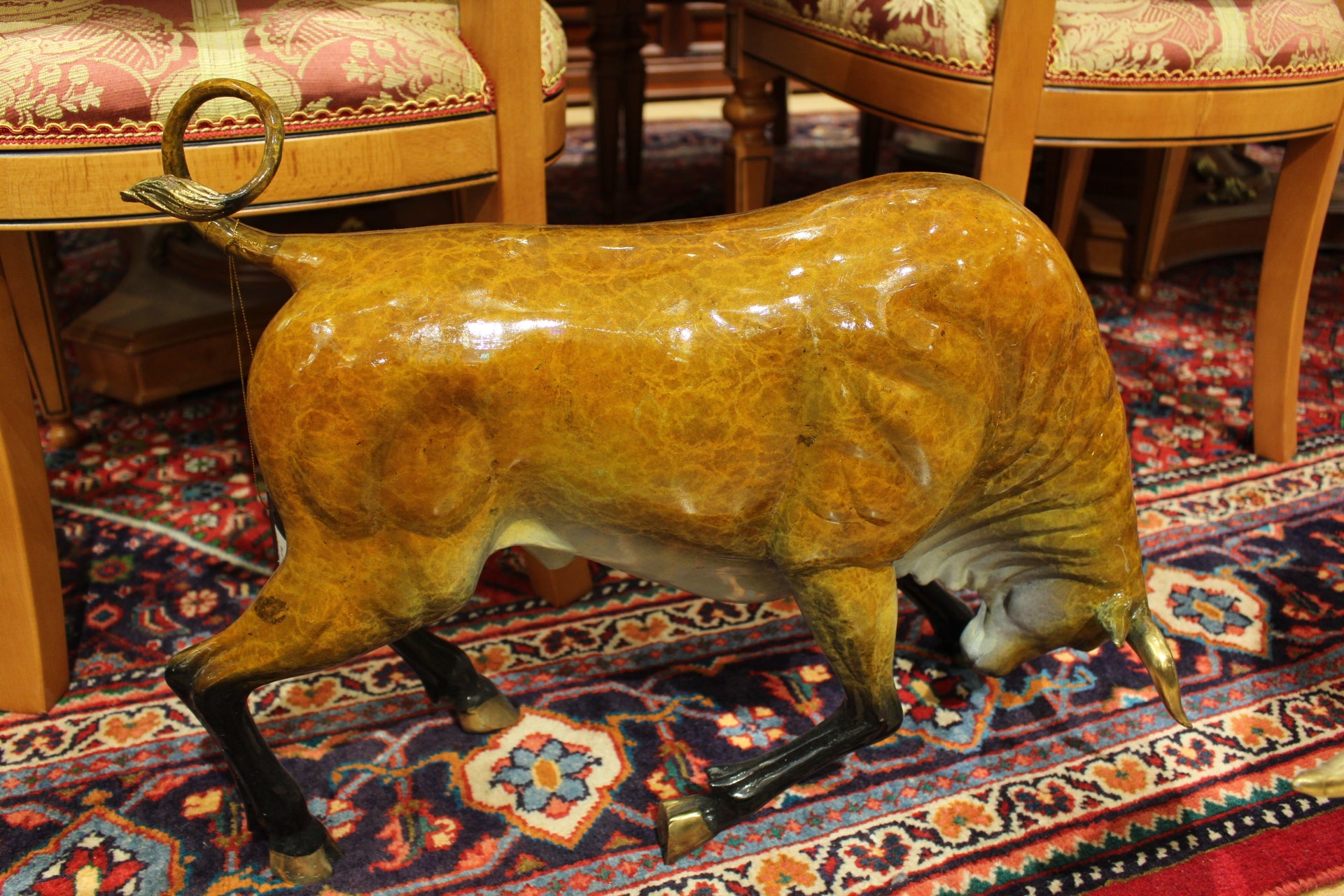Bull Heads Down -Large Bronze Statue -  Size: 48"L x 12"W x 30"H. 
