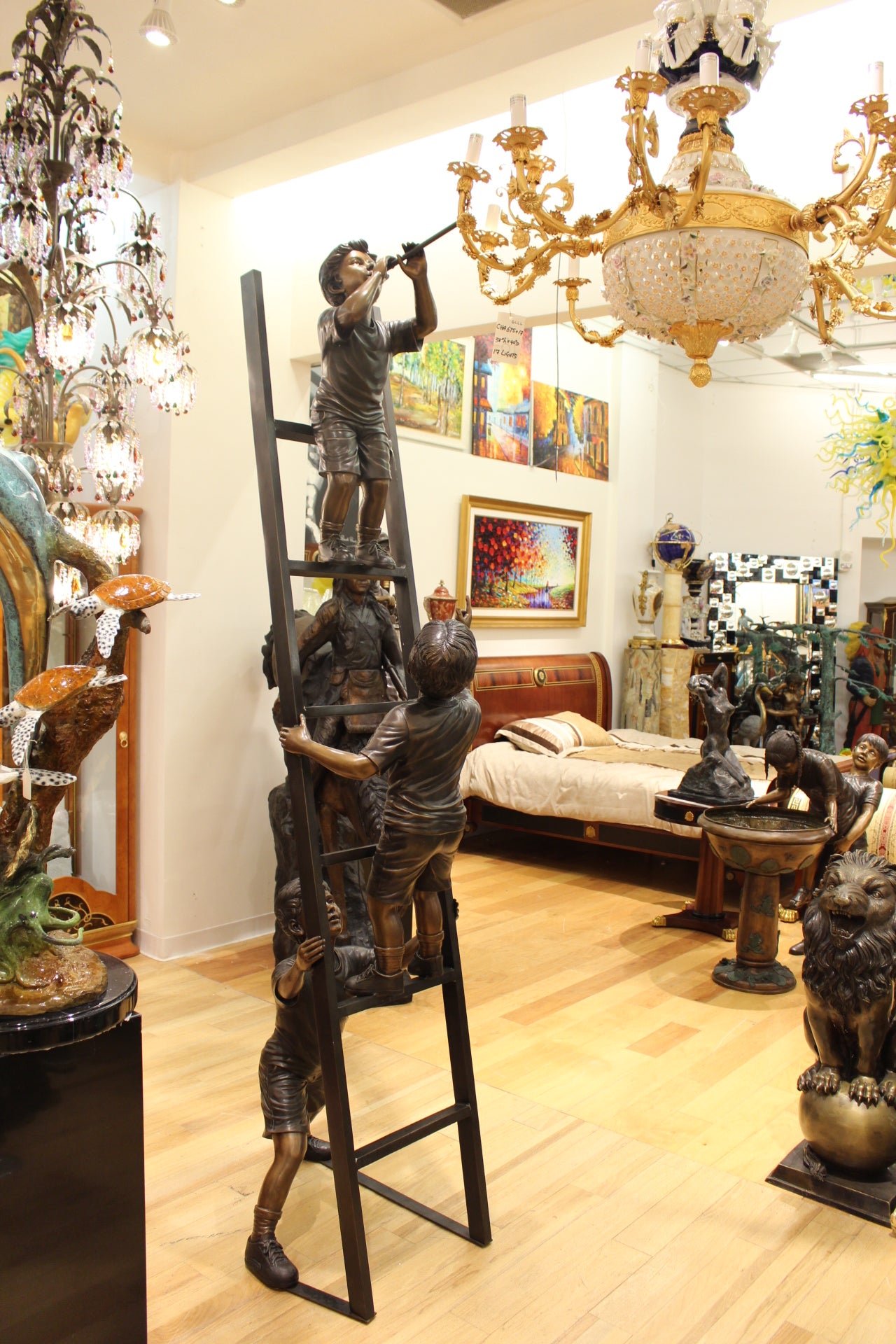 Three Children Playing on Ladder Bronze Statue -  Size: 24"L x 27"W x 96"H. 