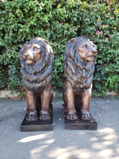 Pair of Life-size lions bronze statues -  Size: 17"L x 35"W x 47"H.