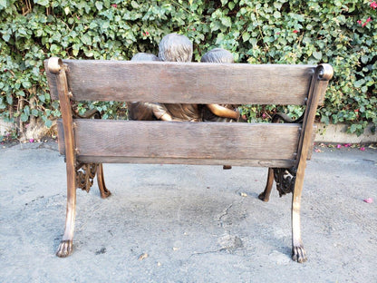 Three kids on a Bench Holding a Bird Bronze Statue -  Size: 40"L x 30"W x 33"H.