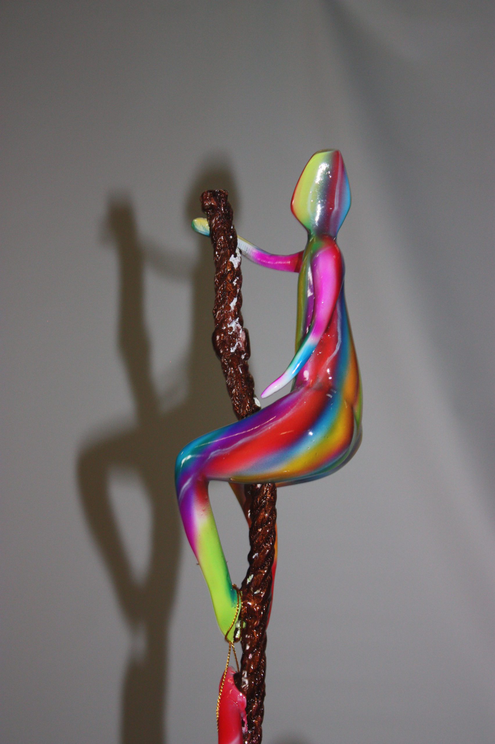 Three man made of Bronze climbing on rope -  Size: 10"L x 13"W x 37"H. 