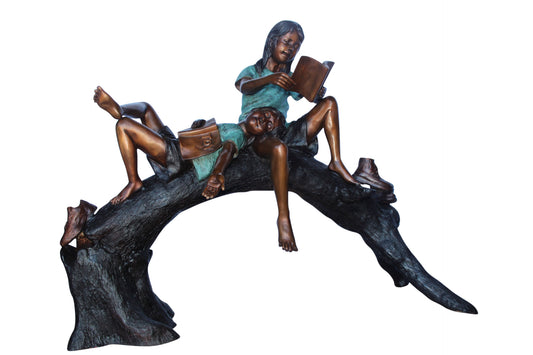 Boy and girl reading on arched tree bronze statue  -  Size: 70"L x 29"W x 56"H.