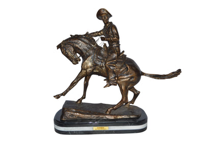 Cowboy Bronze replica by Fredric Remington - Size: 25"L x 9"W x 23"H.
