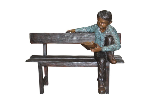 boy Sitting on a Bench reading book bronze Statue -  Size: 43"L x 20"W x 36"H.