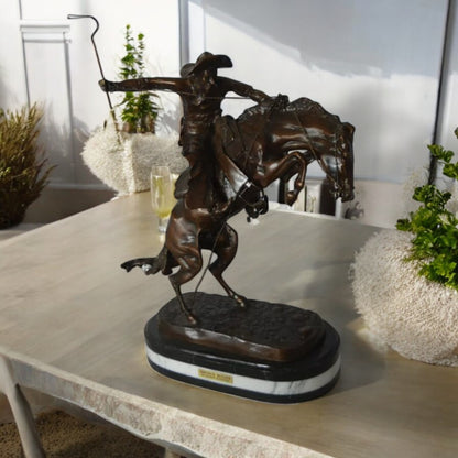 Bronco Buster by Remington Bronze Statue on a triple marble -  21"x 10"x 26"H.