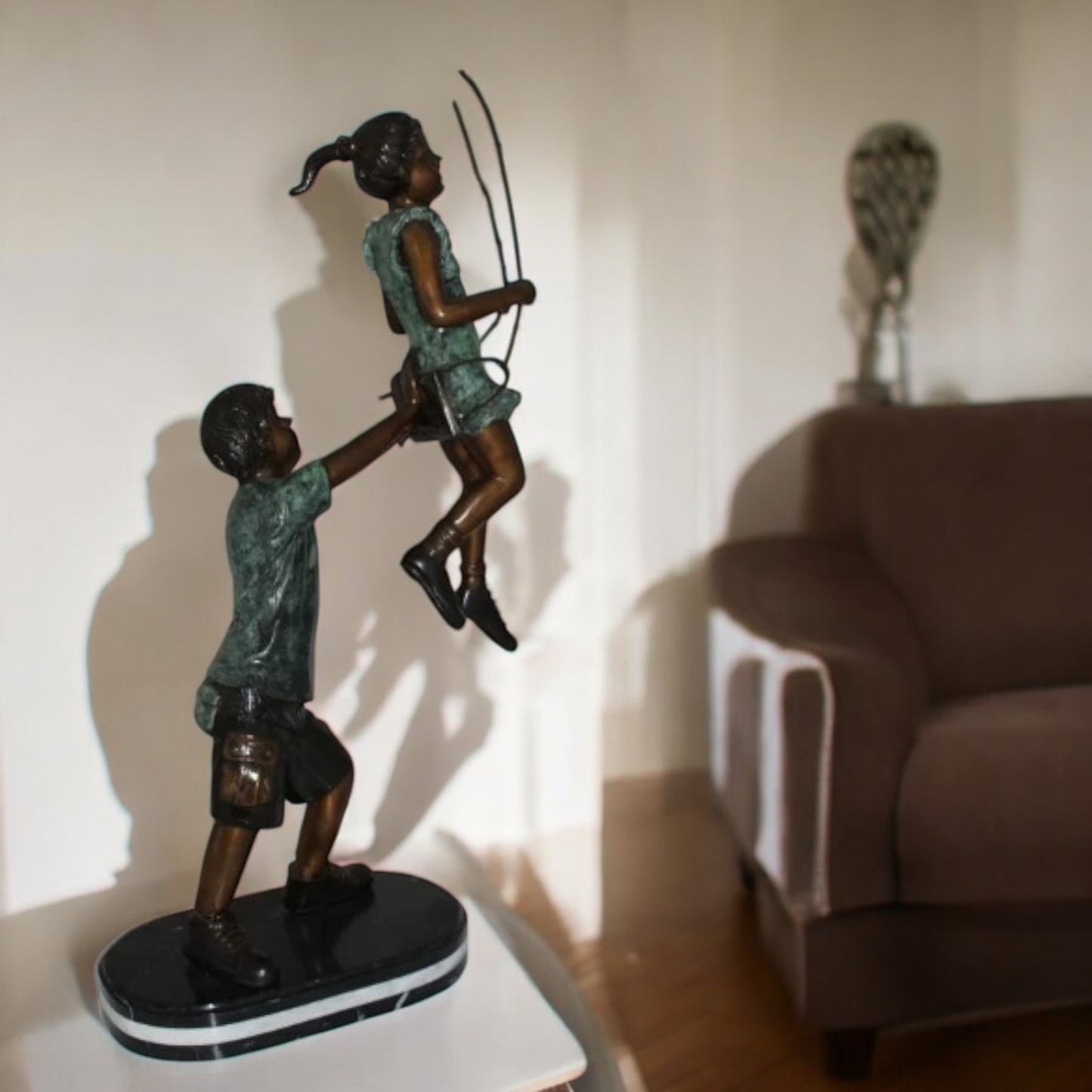Children-on-swing-Bronze-Statue -  Size: 20"L x 9"W x 39"H.